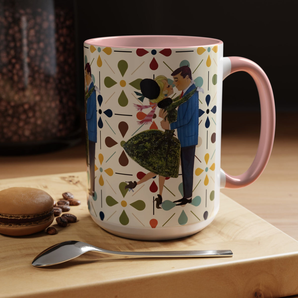 Mid Century Modern 50s Christmas mug featuring a retro couple dancing among colorful floral patterns and a pink handle.