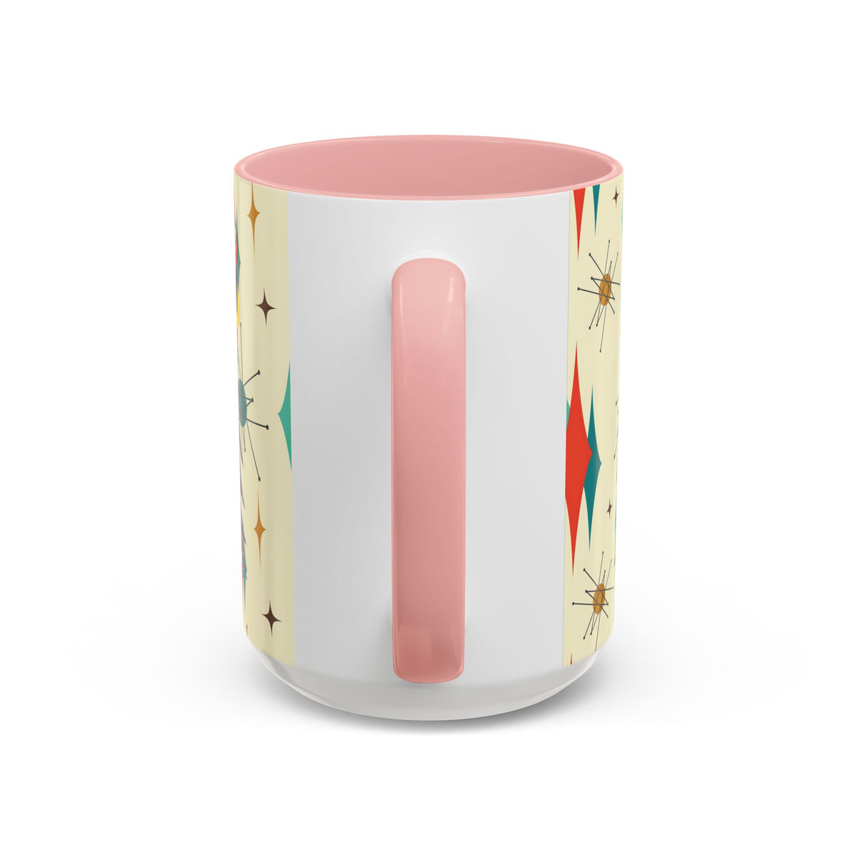 Mid Century Modern 50s Kitsch Christmas starburst coffee mug with a pink handle and retro design in teal, red, and gold.