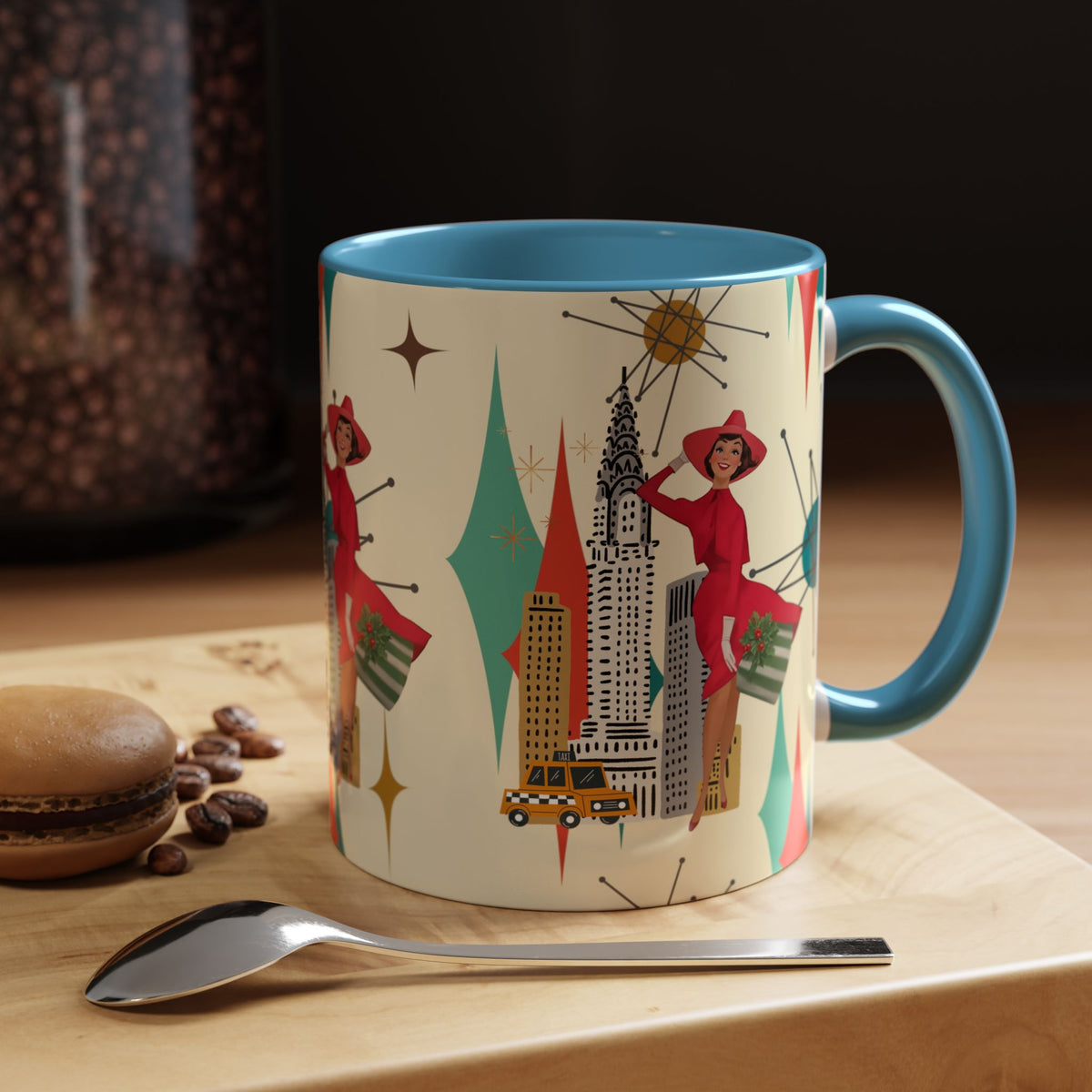 Mid Century Modern coffee mug featuring a vintage cityscape design with a kitschy Christmas theme and starburst accents.