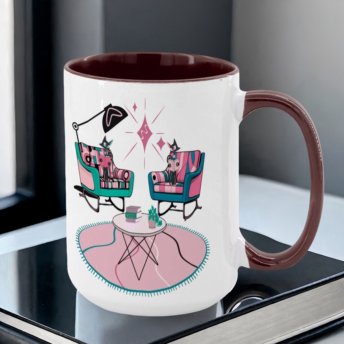 Colorful 15oz mug featuring atomic reading cats in mid-century modern chairs with a retro design and vibrant colors.