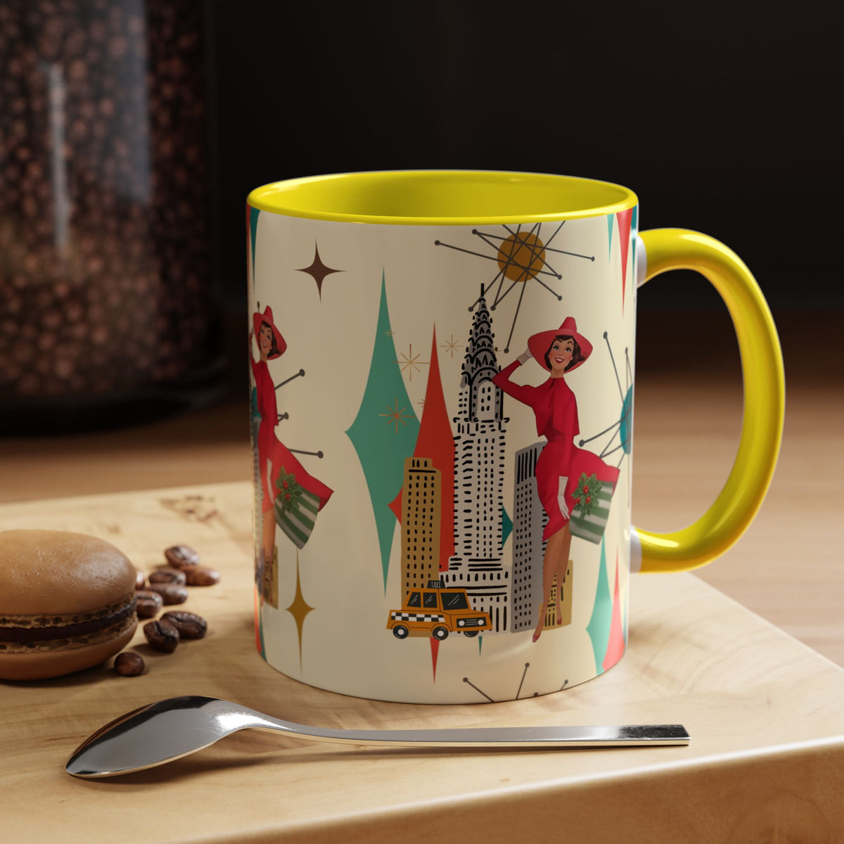 Mid Century Modern coffee mug featuring a kitschy Christmas design with a vintage cityscape and starburst accents.
