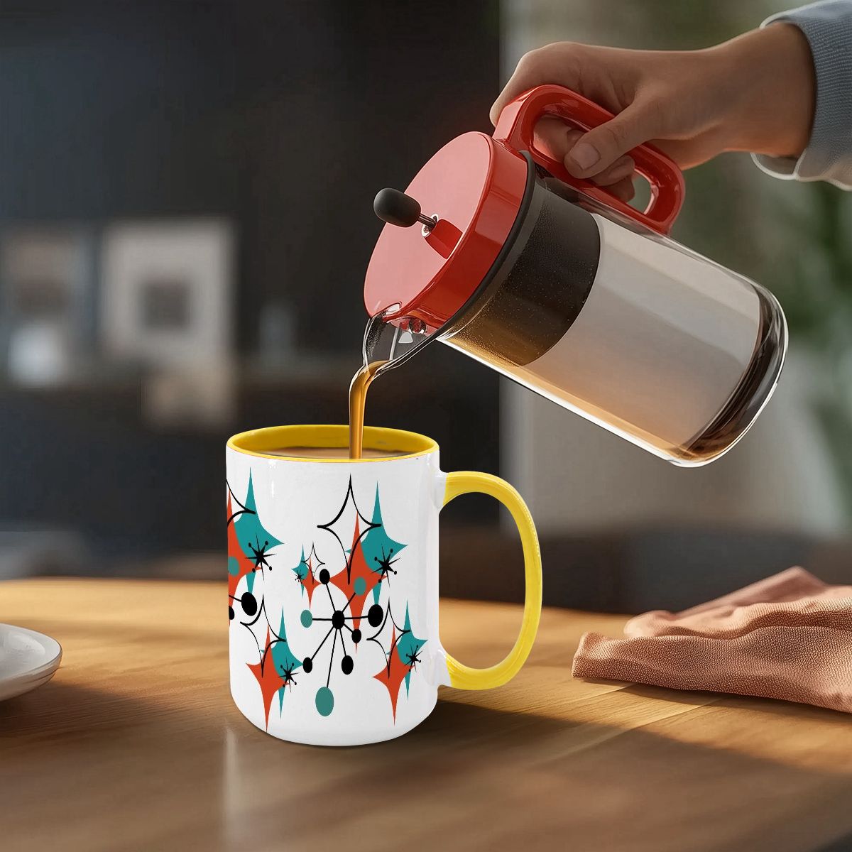Colorful 15oz mug featuring a Mid Century Modern atomic starburst design, with vibrant teal, orange, and black accents.