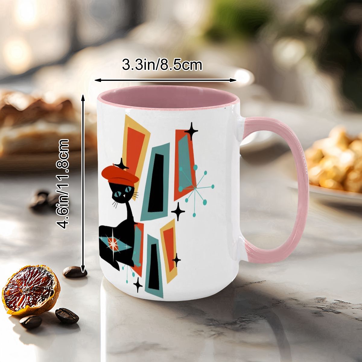 Mid Century Modern coffee mug featuring an atomic cat design with geometric shapes in vibrant colors.