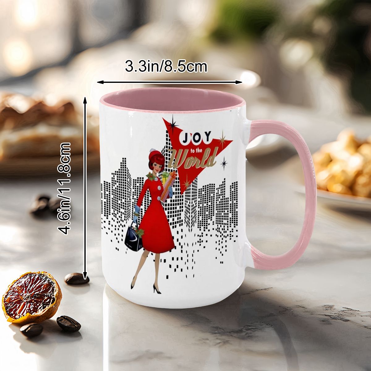Mid Century Modern holiday mug featuring a cityscape design and a woman in a red dress with "Joy to the World" text.