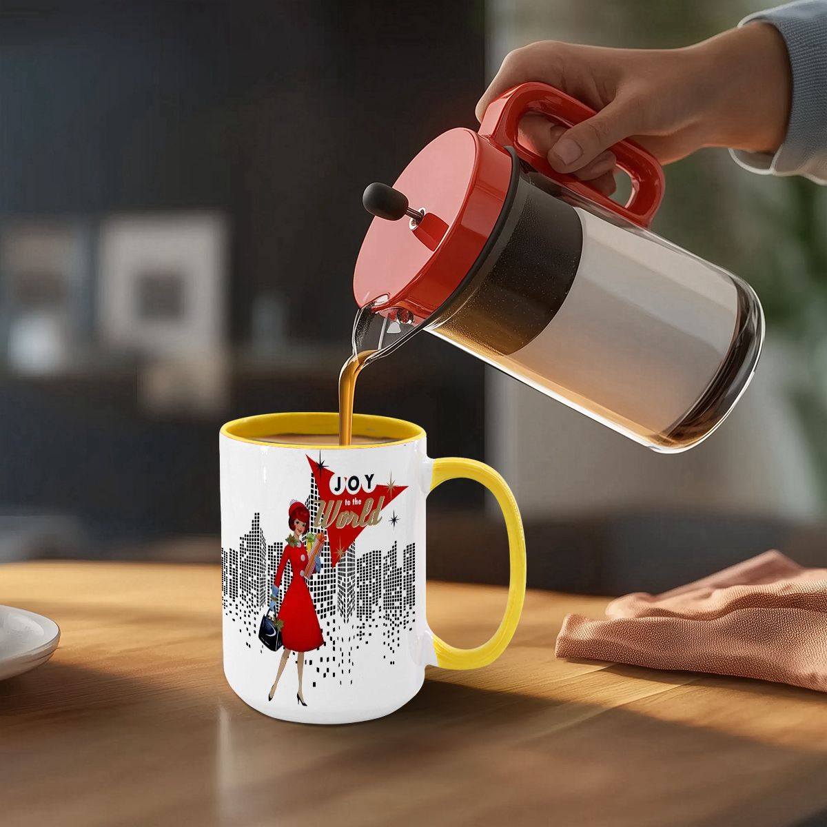 Mid Century Modern Christmas Joy To The World mug featuring a cityscape design and a stylish woman in a red dress.